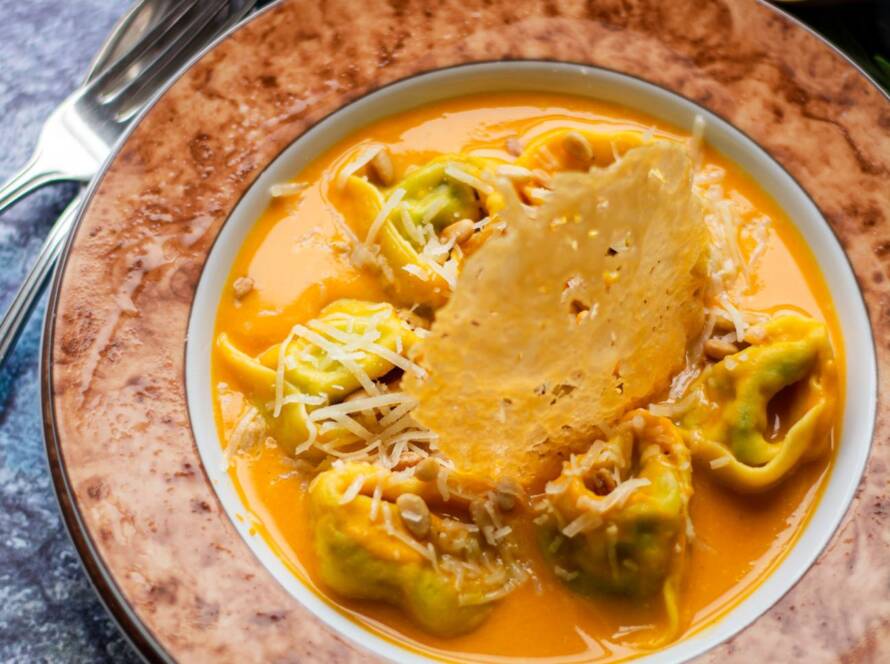 Butternut squash tortellini with spinach and ricotta filling, Parmesan crisp and toasted pine kernels