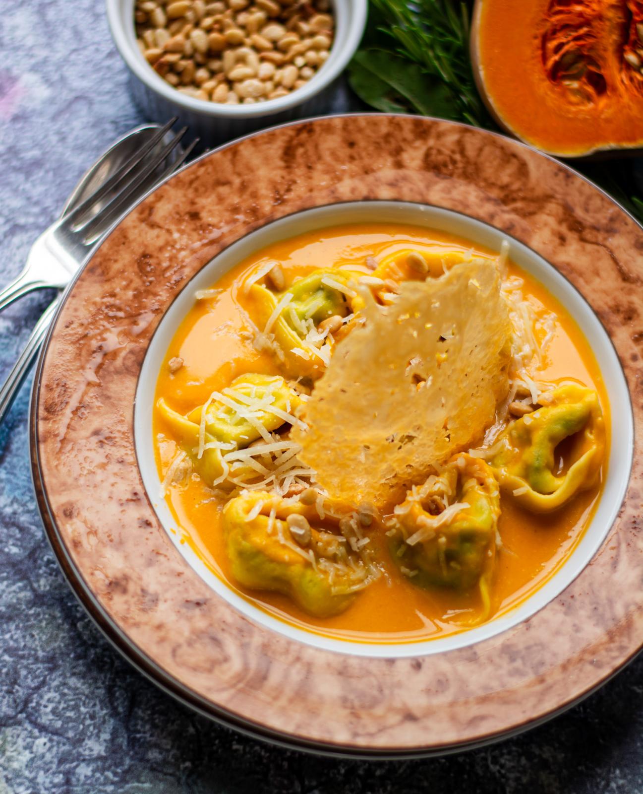 Butternut squash tortellini with spinach and ricotta filling, Parmesan crisp and toasted pine kernels